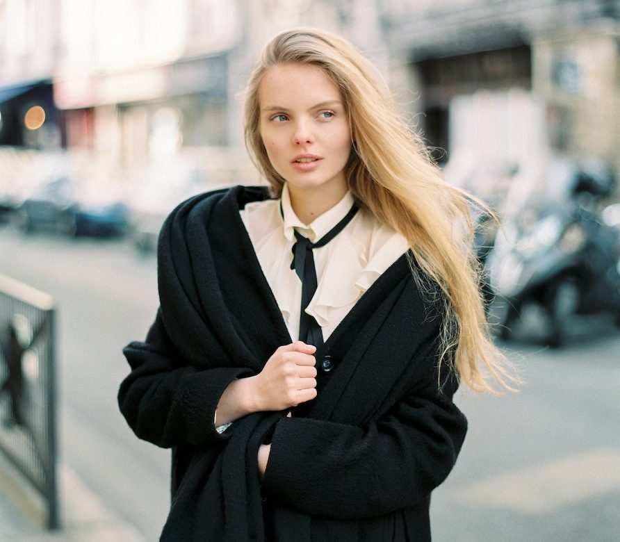 Blonde Woman in White Shirt on Street